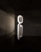 Escultura de parede Passante