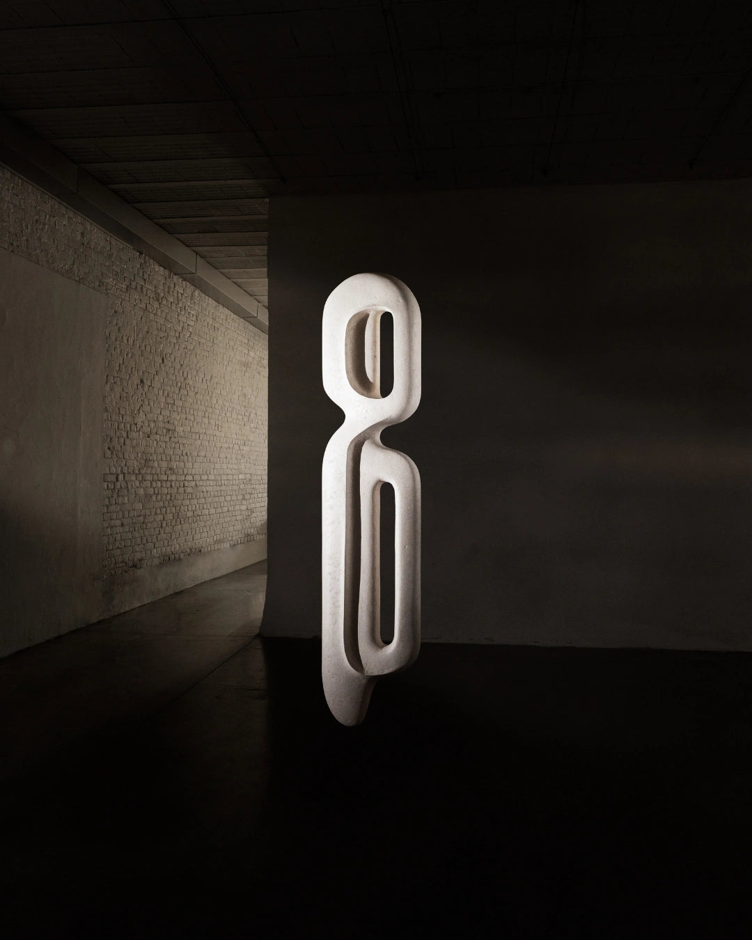 Escultura de parede Passante