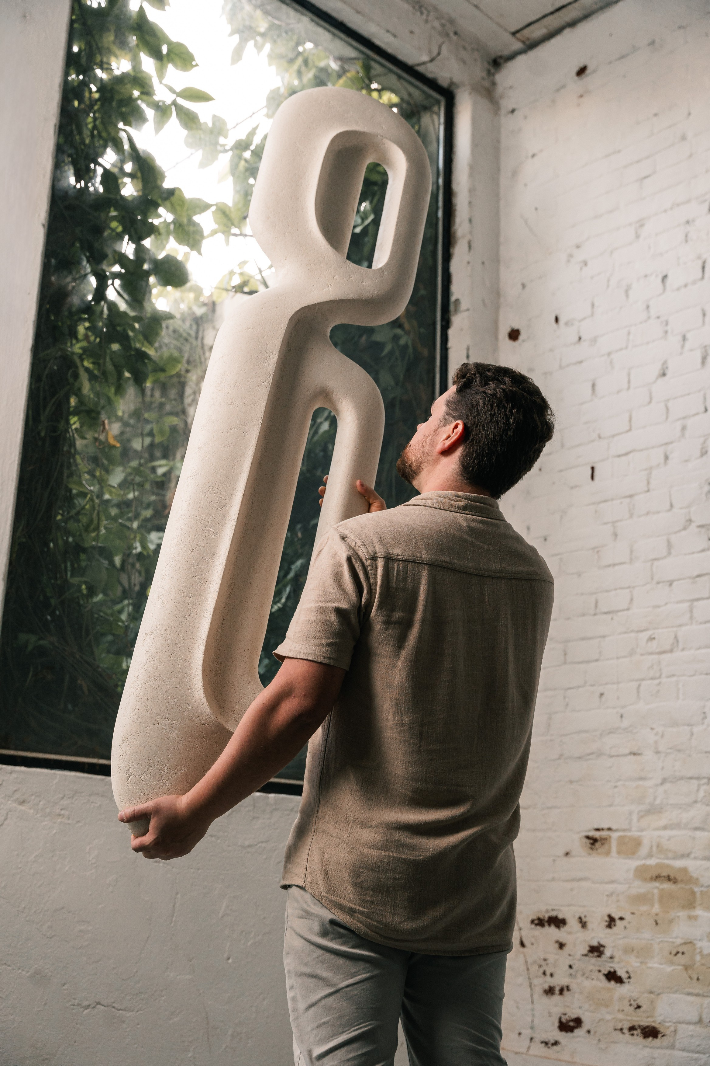 Escultura de parede e centro de mesa Passante